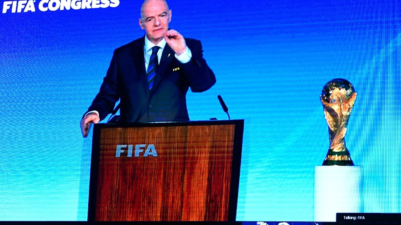 A speech by FIFA president Gianni Infantino is broadcast on a screen in Saudi's capital Riyadh as the Gulf kingdom is confirmed as 2034 World Cup host