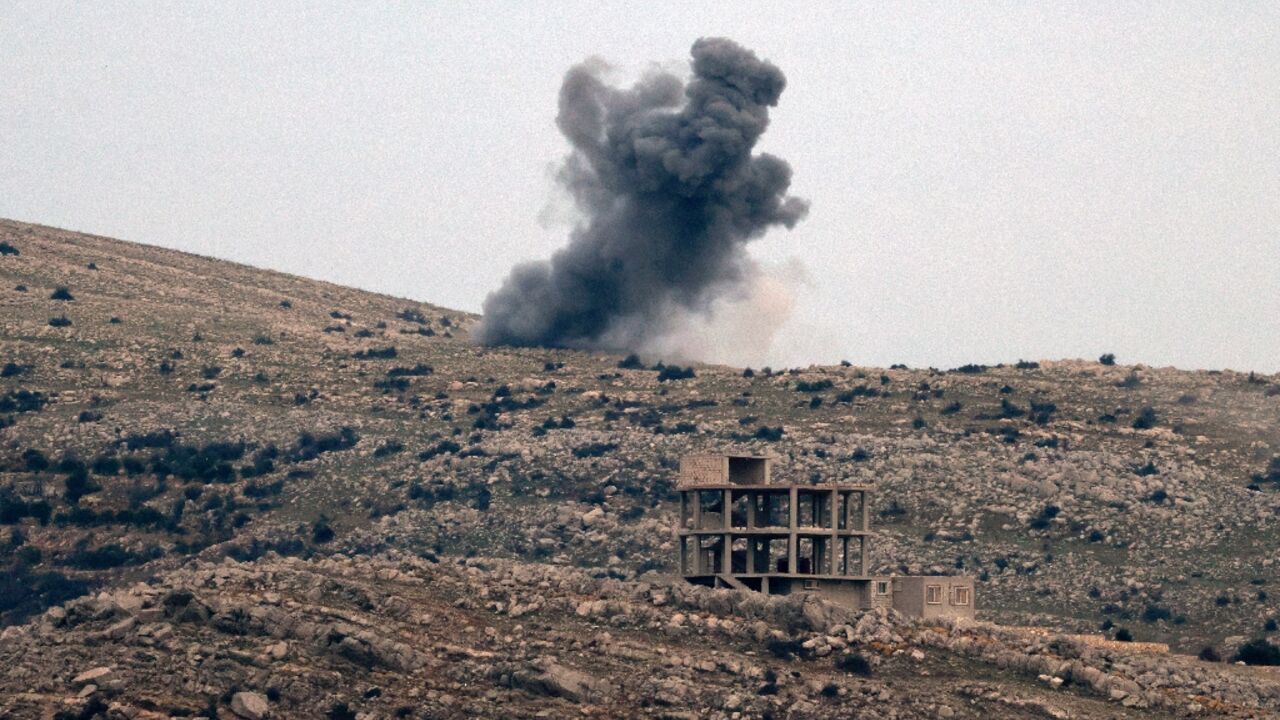 This picture taken from the Israel-controlled part of the Golan Heights shows smoke rising over the outskirts of the Syrian village of Hader during Israeli bombardment of "armed individuals" attacking a UN post