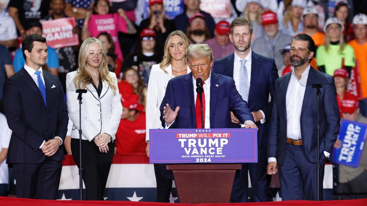 Donald Trump (C), appointed the father of Tiffany Trump's (2nd L) spouse Michael Boulos (far L) to the key diplomatic position