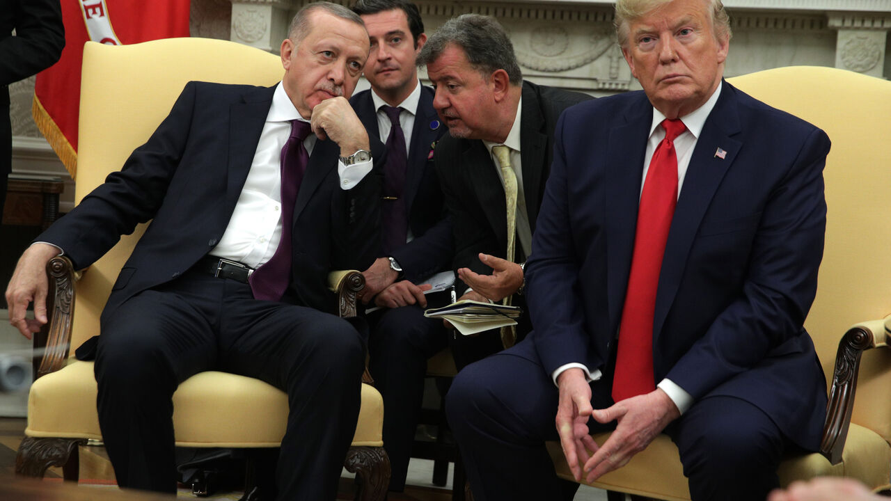 WASHINGTON, DC - NOVEMBER 13: Turkish President Recep Tayyip Erdogan listens to translation as he meets with U.S. President Donald Trump and five Republican U.S. senators in the Oval Office of the White House on November 13, 2019 in Washington, DC. During their meeting, Trump and Erdogan were scheduled to discuss Turkey's purchase of a Russian air defense system as well as the Turkish offensive against the Kurds in Syria. Also in DC today, the first public impeachment hearings took place in the House Intell