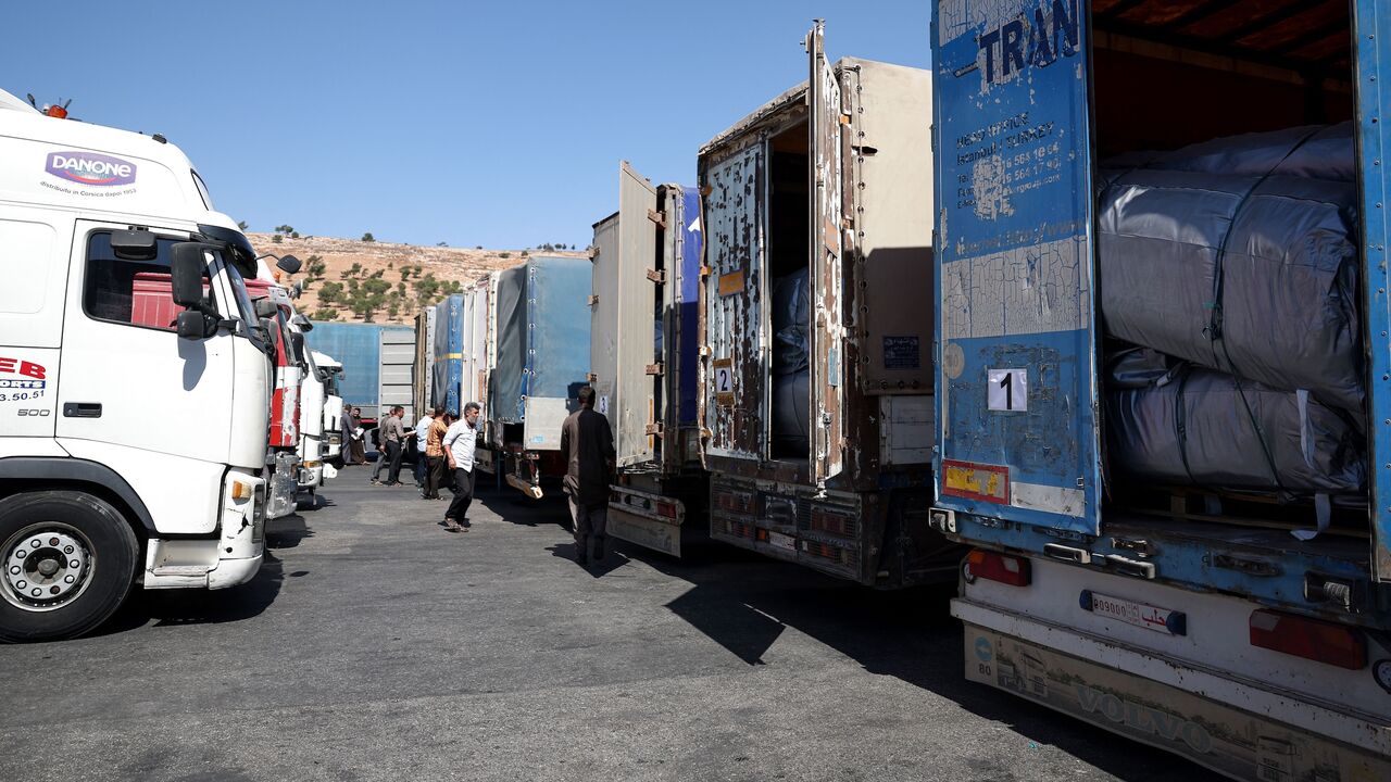 A convoy carrying humanitarian aid arrives in Syria after crossing the Bab al-Hawa border crossing with Turkey, on Sept. 19, 2023. 