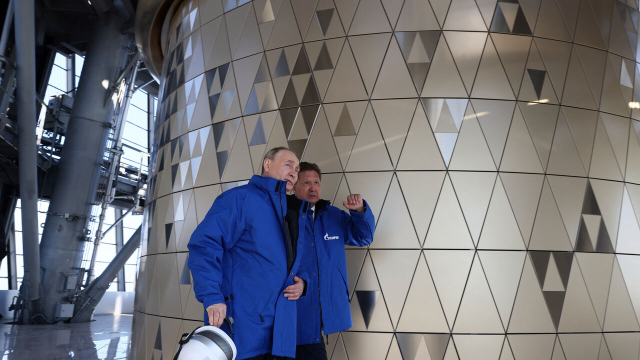 In this pool photograph distributed by Russian state agency Sputnik, Russia's President Vladimir Putin (L) speaks with Russia's energy giant Gazprom CEO Alexei Miller as they visit the Lakhta Centre skyscraper, the headquarters of Russian gas monopoly Gazprom in Saint Petersburg on June 5, 2024. (Photo by Kirill MOROZOV / POOL / AFP) (Photo by KIRILL MOROZOV/POOL/AFP via Getty Images)