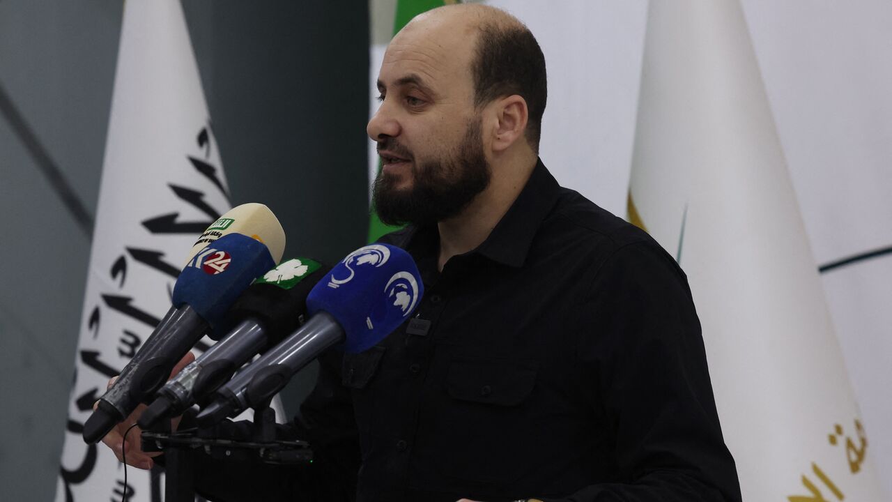 Mohamed Bashir, who heads HTS's so-called Salvation Government, holds a press conference in the rebel-held northwestern Syrian city of Idlib on Nov. 28, 2024. 