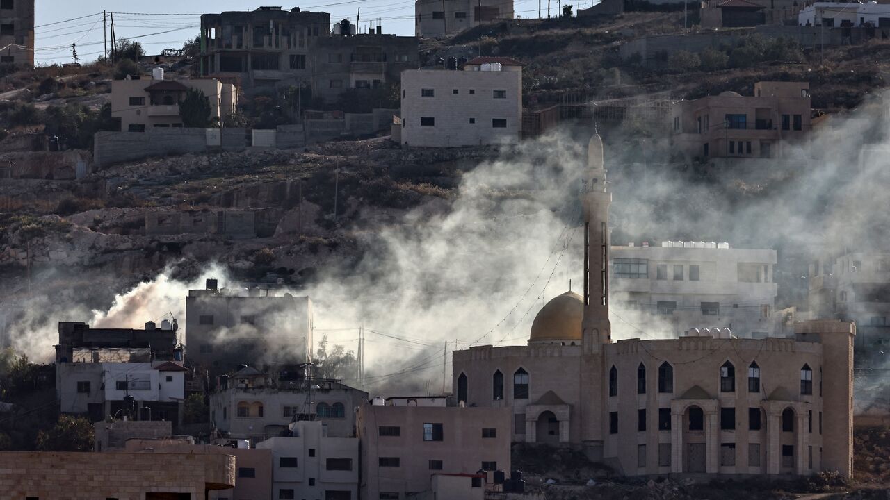 Smoke rises following an explosion amid clashes between Palestinian Authority security forces and militants in the Jenin camp in the Israel-occupied West Bank on Dec. 15, 2024. 