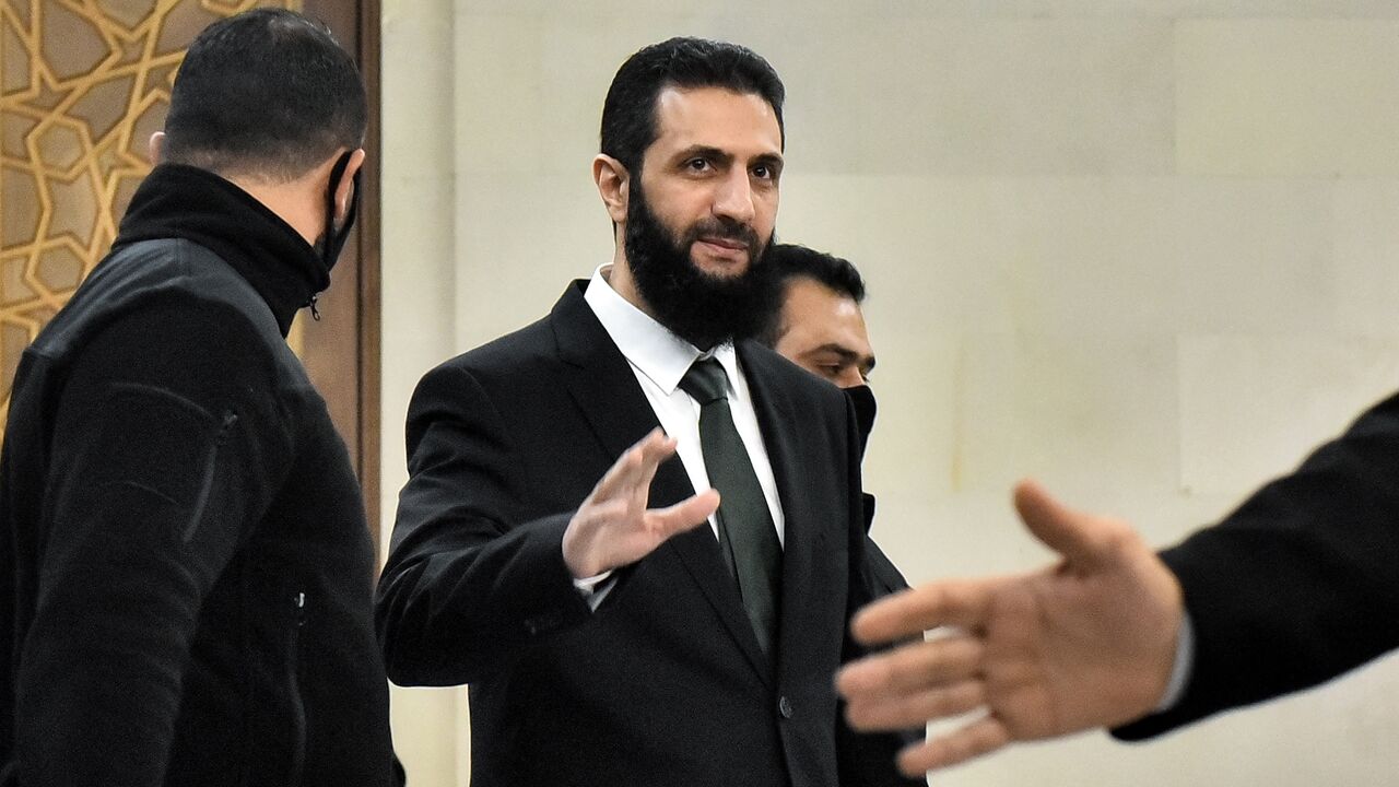 Hayat Tahrir al-Sham leader Ahmed al-Sharaa arrives for a meeting with visiting Druze officials from Lebanon's Progressive Socialist Party, in Damascus, on Dec. 22, 2024. 