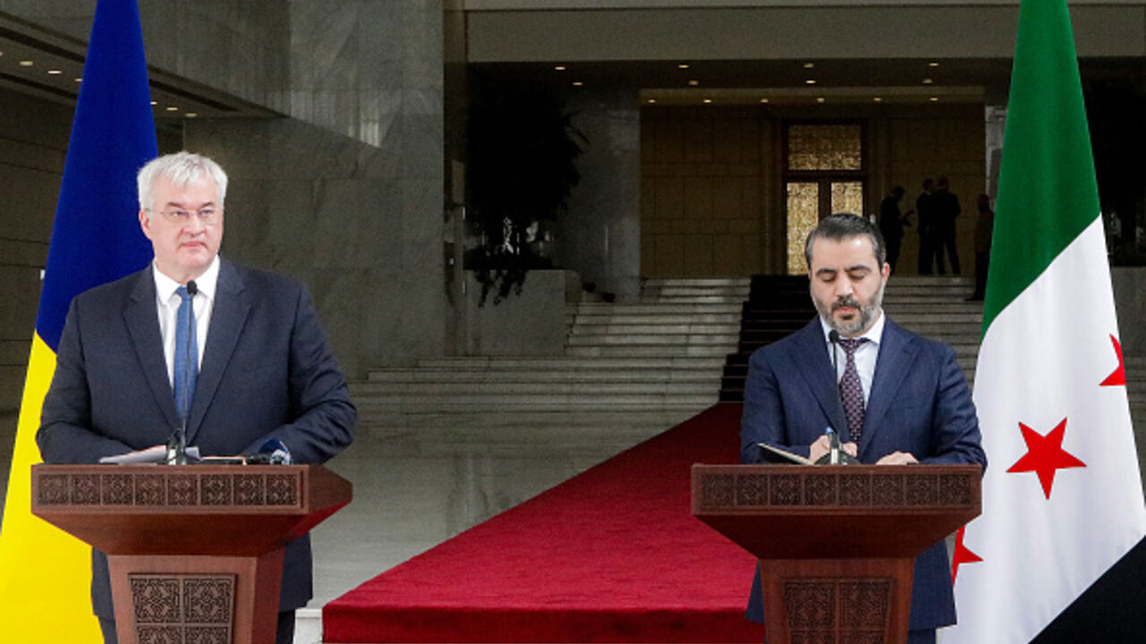 Asaad Shaybani, Foreign Minister for the interim Syrian government, and Ukraine's Foreign Minister Andrii Sybiha (Andriy Sybiga) give a joint press conference in Damascus on December 30, 2024. Ukraine's Foreign Minister on December 30 urged the new Syrian leader to expel Russia from the country during an unannounced visit to Damascus. Moscow was one of former president Bashar al-Assad's key backers, intervening to help to turn the tide of Syria's civil war in his favour in 2015. The ex-president's toppling
