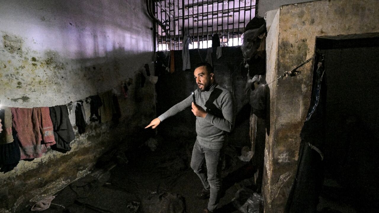 Former prisoner Mohamed Darwish gives AFP a guided tour of the feared detention centre of the Palestine Branch of Syrian military intelligence where he was interrogated for 120 days Former prisoner Mohamed Darwish gives AFP a guided tour of the feared detention centre of the Palestine Branch of Syrian military intelligence where he was interrogated for 120 days