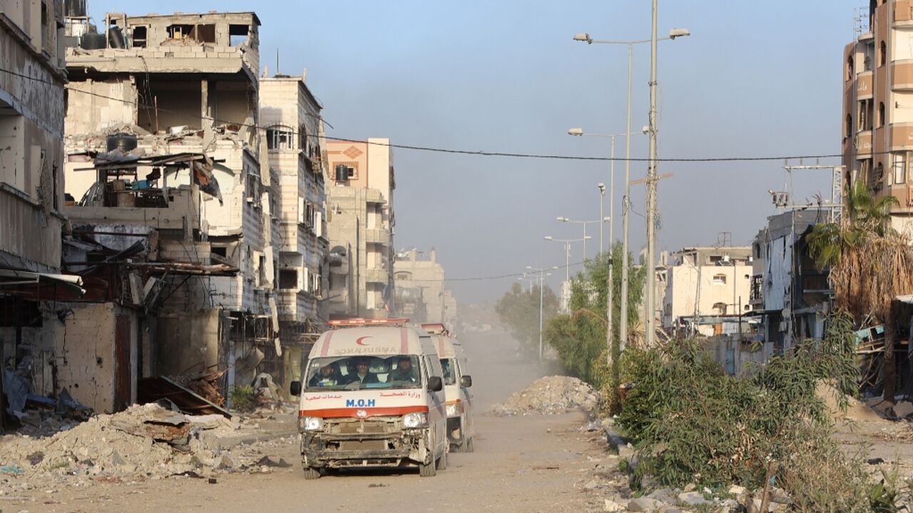 Ambulances transport wounded Palestinians from Kamal Adwan Hospital to Al-Shifa hospital in Gaza City