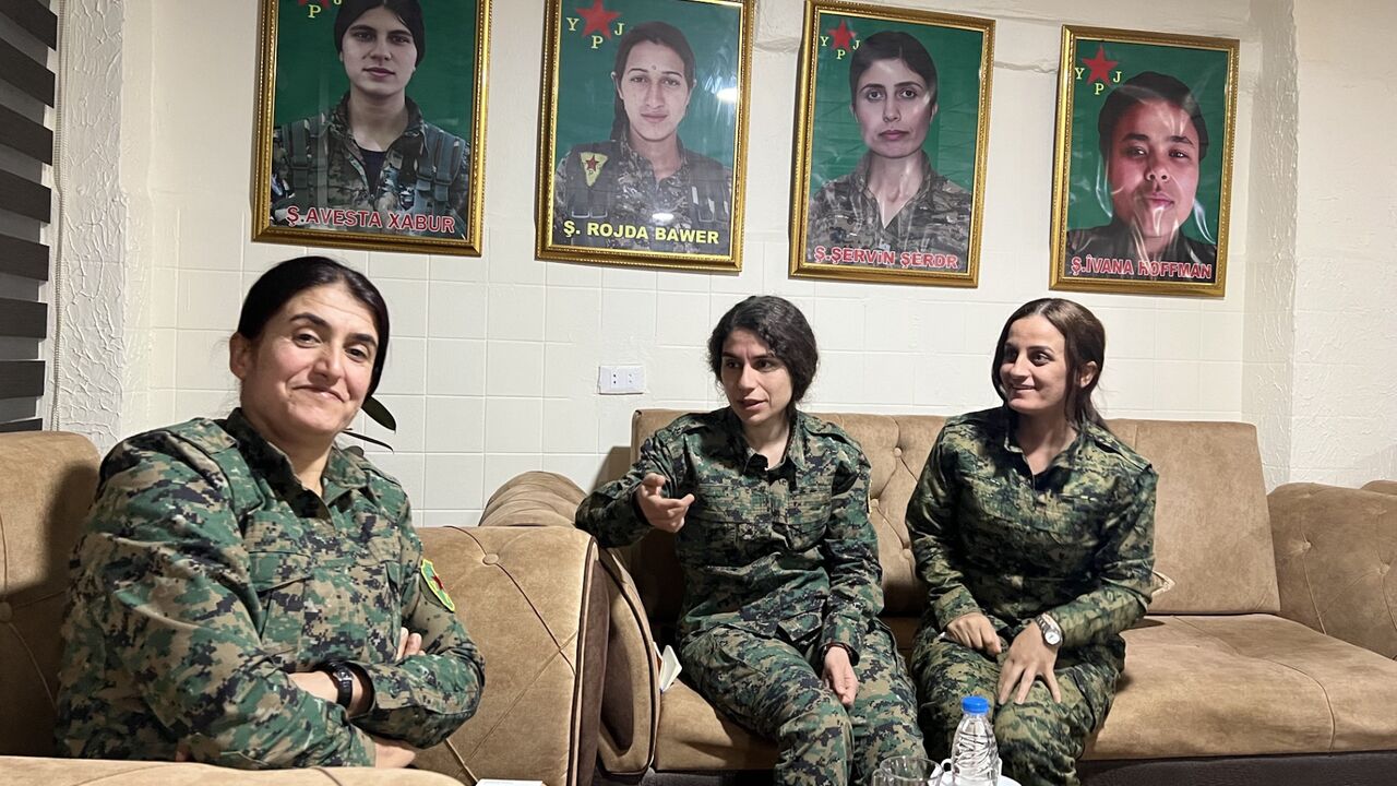 YPJ Commander in Chief Rojhelat Afrin pictured at YPJ headquarters near Al-Hasakh with YPJ spokesperson Heval Roksana and YPJ Field Commander Heval Kurdistan, Nov. 23, 204.