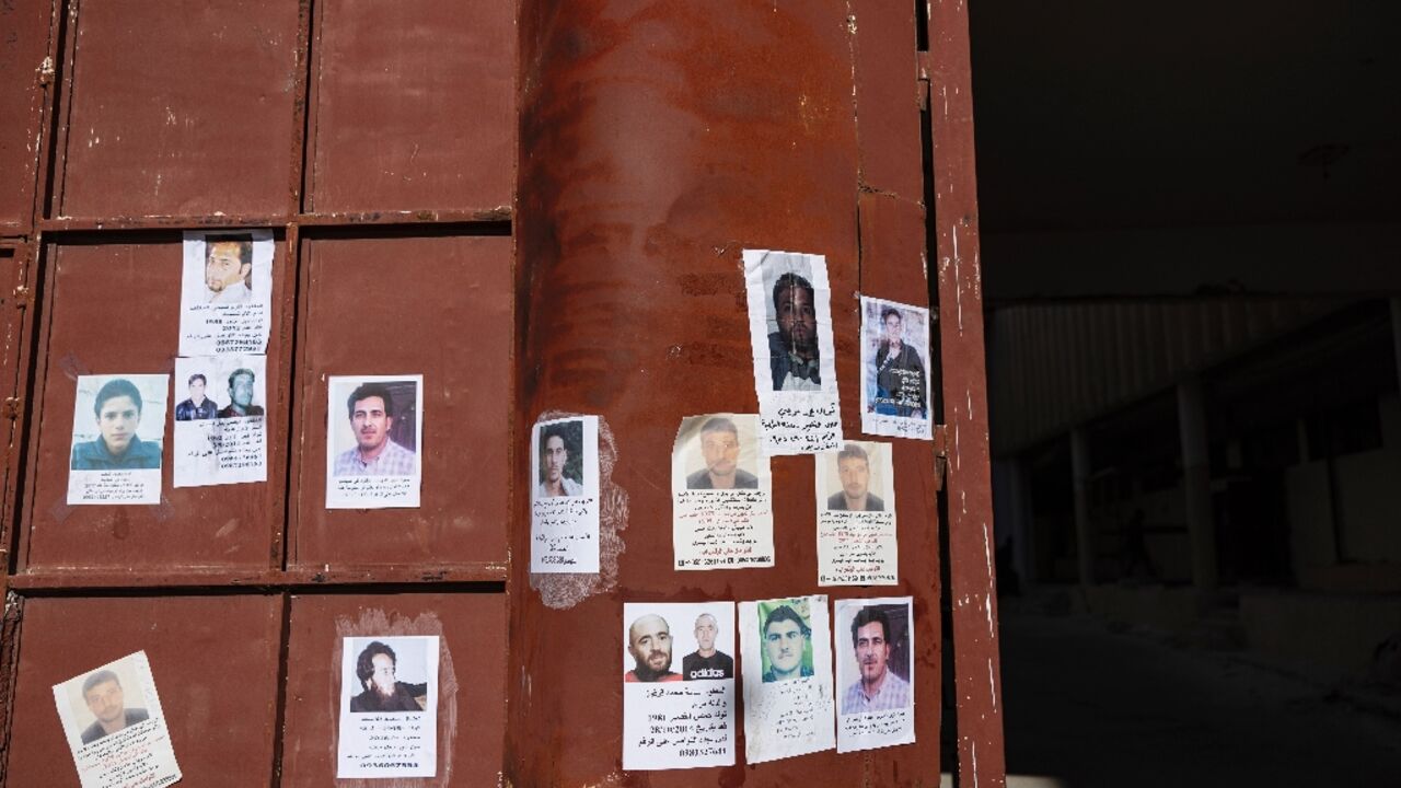Pictures of missing people hang on the main gate of Syria's Saydnaya prison, which epitomises the atrocities of the ousted Assad government Pictures of missing people hang on the main gate of Syria's Saydnaya prison, which epitomises the atrocities of the ousted Assad government