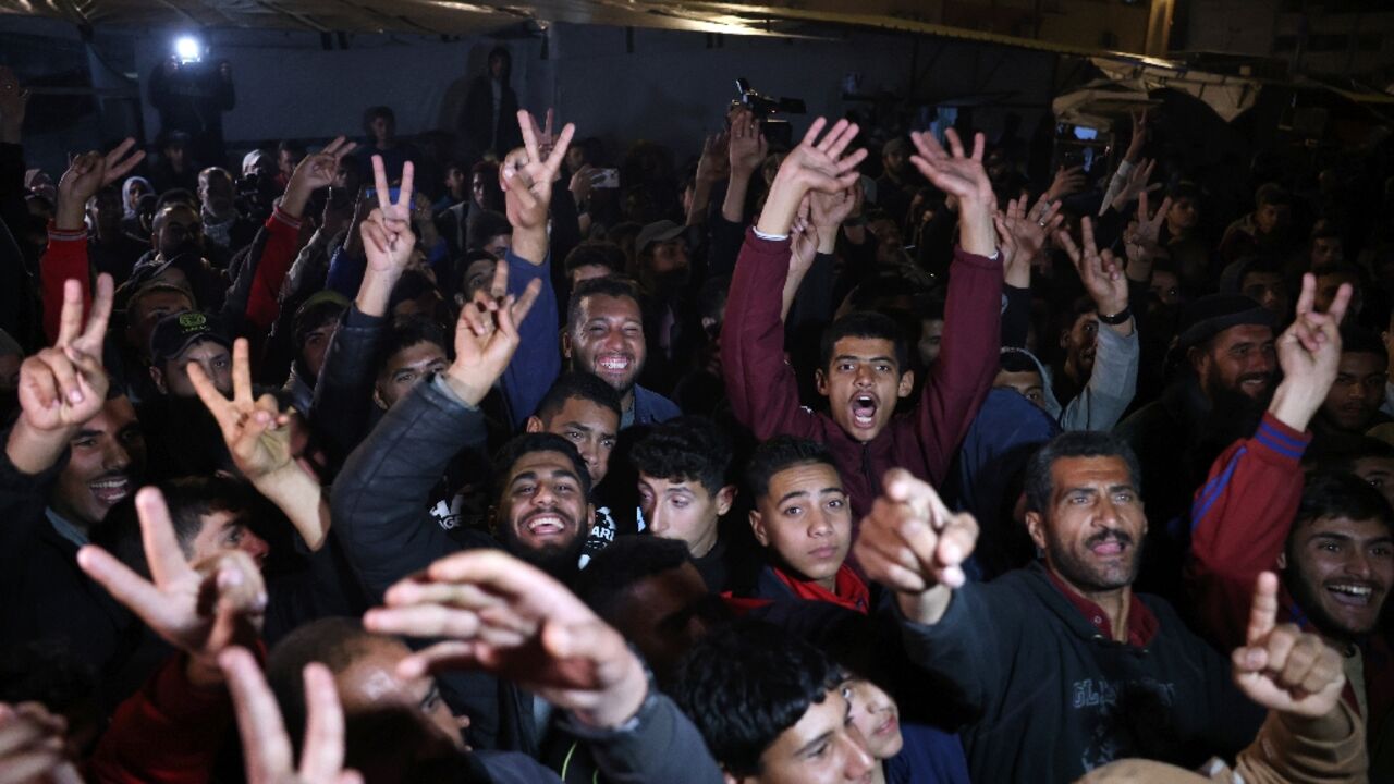 People in southern Gaza celebrate the announcement of a deal to end the 15-month war with Israel