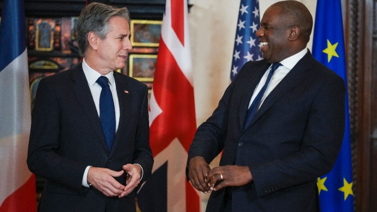 US Secretary of State Antony Blinken  talks to Britain's Foreign Secretary David Lammy ahead of a meeting at Villa Madama in Rome on Syria