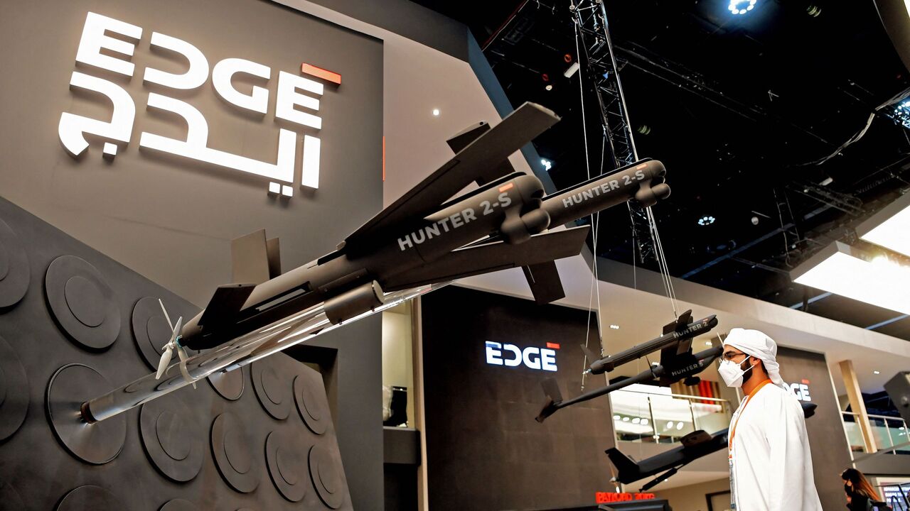 A visitor views Hunter 2-S unmanned aerial systems (UAS) "swarming drones" by EDGE advanced technology group for defense on display at the UMEX Exhibition showcasing drones, robotics, and unmanned systems at the Abu Dhabi National Exhibition Centre in the gulf emirate on Feb. 22, 2022. 