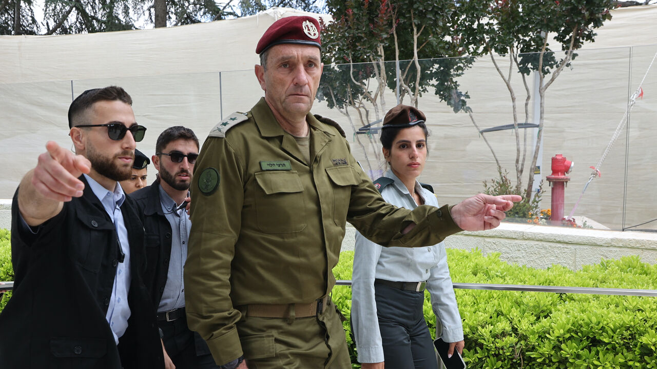 Israeli army chief Herzi Halevi (front) arrives at a ceremony marking Memorial Day for fallen soldiers of Israel's wars and victims of attacks at Jerusalem's Mount Herzl military cemetery on May 13, 2024.