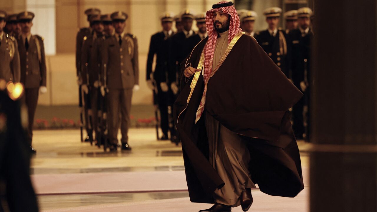 Saudi Arabia's Crown Prince Mohammed bin Salman walks to welcome France's president (not pictured) ahead of their meeting in Riyadh, on Dec. 2, 2024.