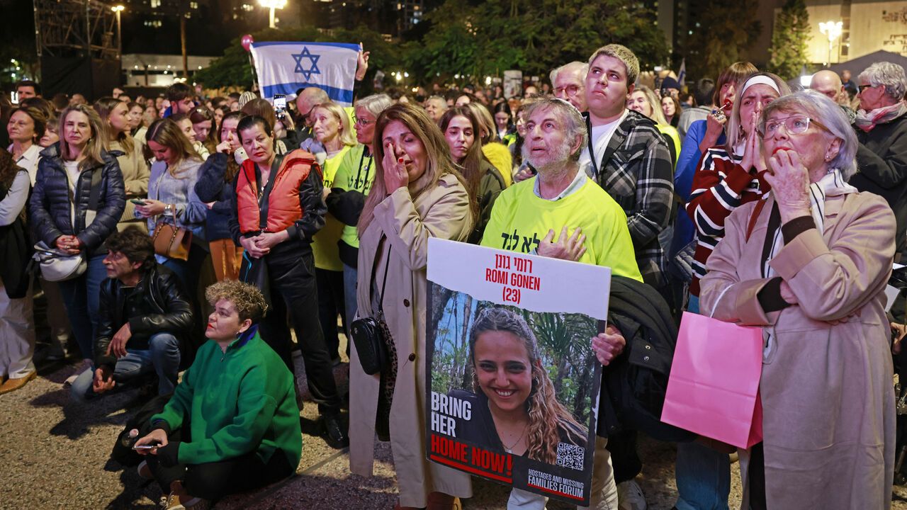 Supporters and relatives of hostages held captive in the Gaza Strip since the Oct. 7, 2023, attacks by Palestinian militants react while watching a live TV broadcast on the release of Israeli hostages, at Hostages Square in Tel Aviv, Israel, Jan. 19, 2025.