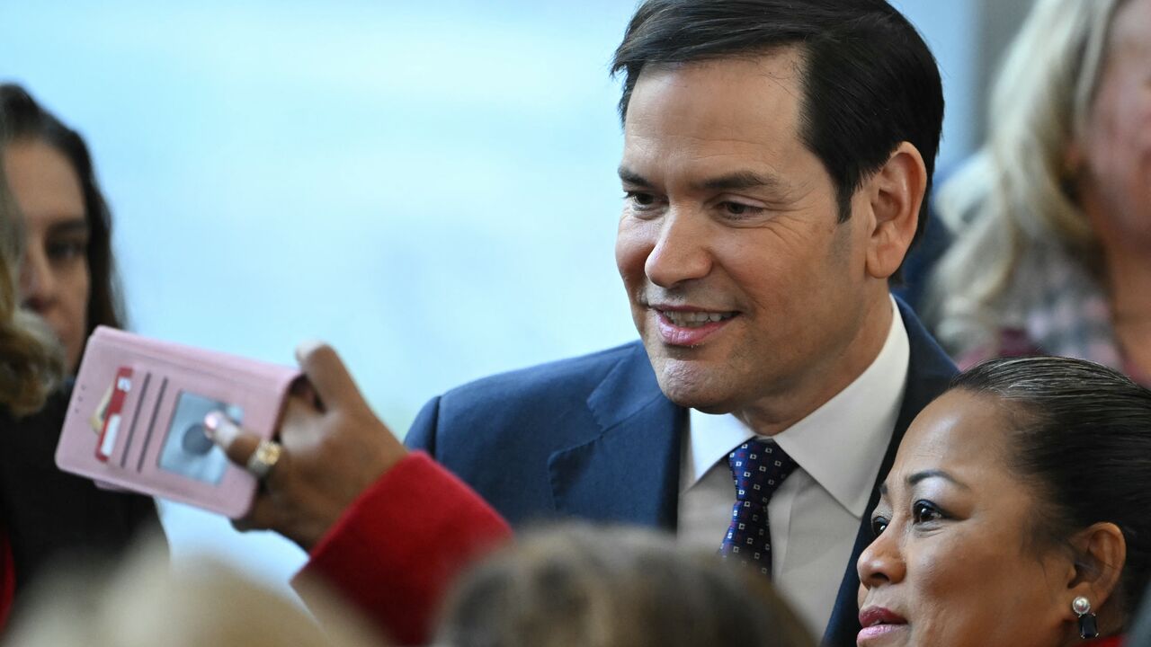 US Secretary of State Marco Rubio greets employees upon arrival at the State Department in Washington, DC, on January 21, 2025. The US Senate unanimously approved Rubio as Secretary of State on January 20, putting the fellow senator on the front line of President Donald Trump's often confrontational diplomacy. (Photo by ANDREW CABALLERO-REYNOLDS / AFP) (Photo by ANDREW CABALLERO-REYNOLDS/AFP via Getty Images)