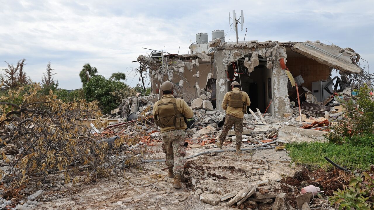 Lebanese soldiers patrol along a residential area that was devastated by the war between Israel and Hezbollah, in the southern coastal town of Naqura, on the border with Israel on Jan. 22, 2025.