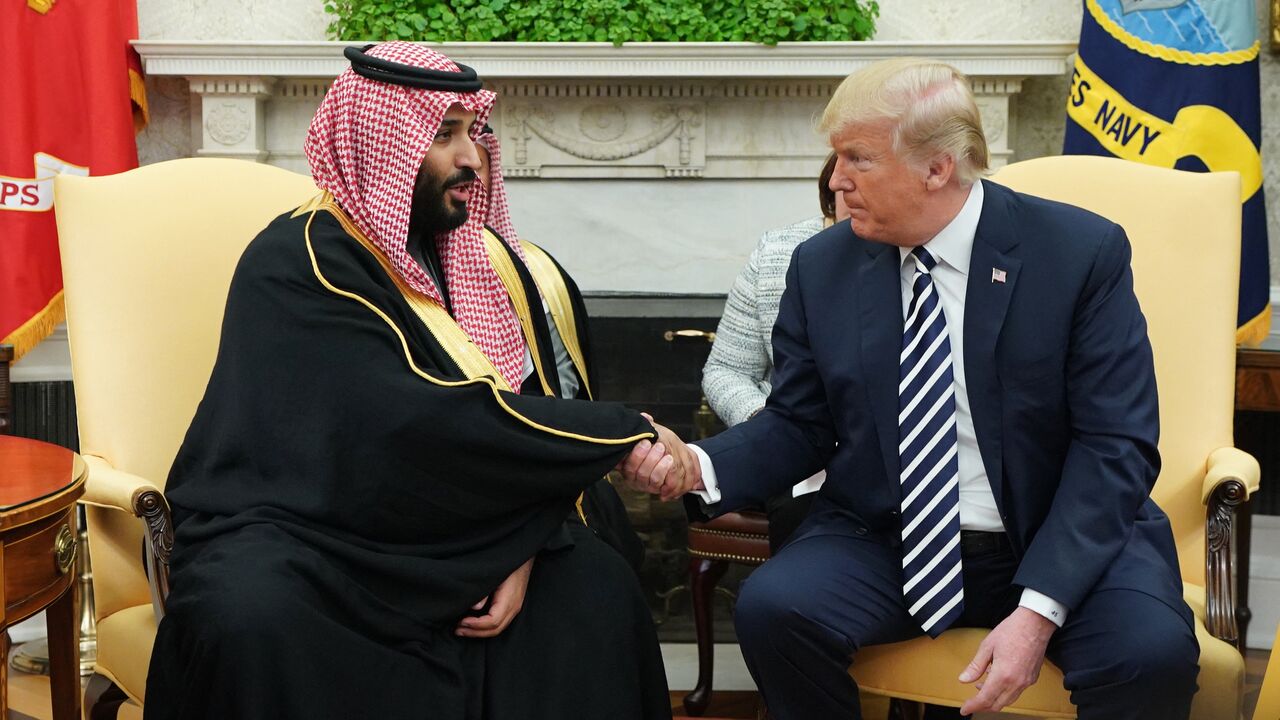 US President Donald Trump (R) shakes hands with Saudi Crown Prince Mohammed bin Salman in the Oval Office of the White House, Washington, DC, March 20, 2018.