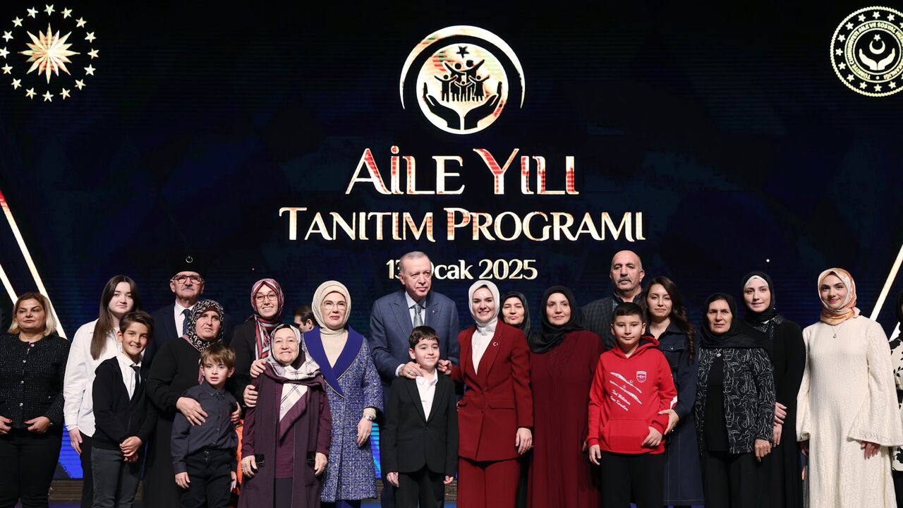 Turkish President Recep Tayyip Erdogan is joined on stage at the debut of the Year of the Family in Ankara, on Jan. 13, 2025.