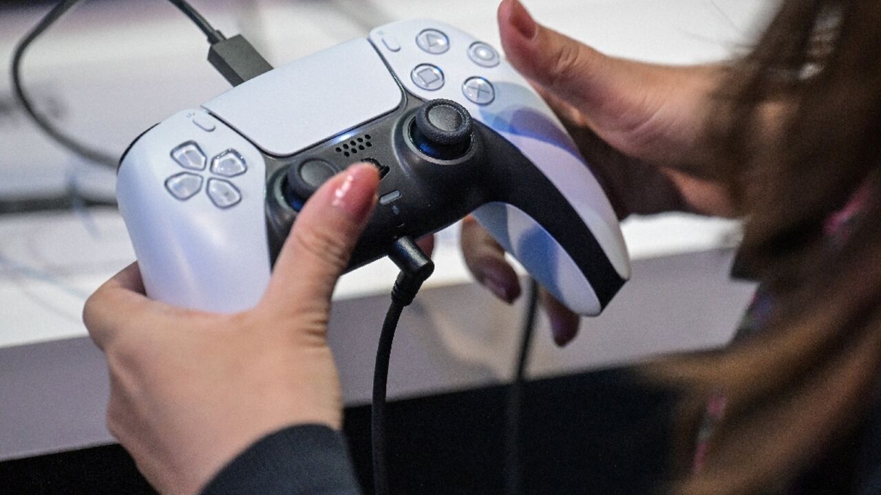 A member of the media tries out Sony's PlayStation 5 console during the Tokyo Game Show in Chiba City on September 26, 2024