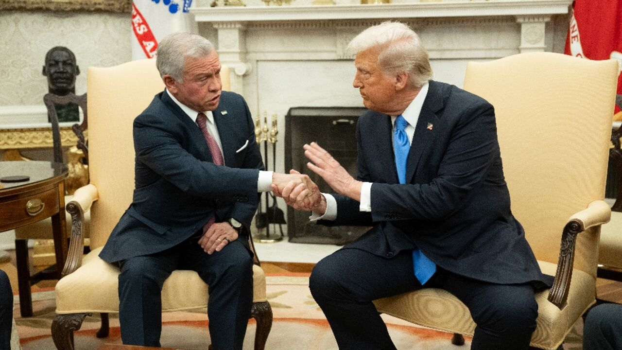 US President Donald Trump (R) shakes hands with King Abdullah II of Jordan during a meeting in the Oval Office of the White House in Washington, DC, on February 11, 2025. US President Donald Trump (R) shakes hands with King Abdullah II of Jordan during a meeting in the Oval Office of the White House in Washington, DC, on February 11, 2025.