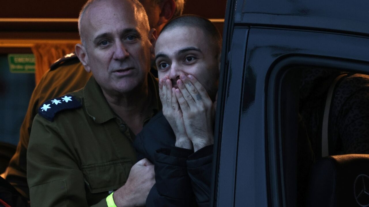 Newly released Israeli hostage Omer Wenkert reacts as a military helicopter takes him to hospital upon release from Gaza