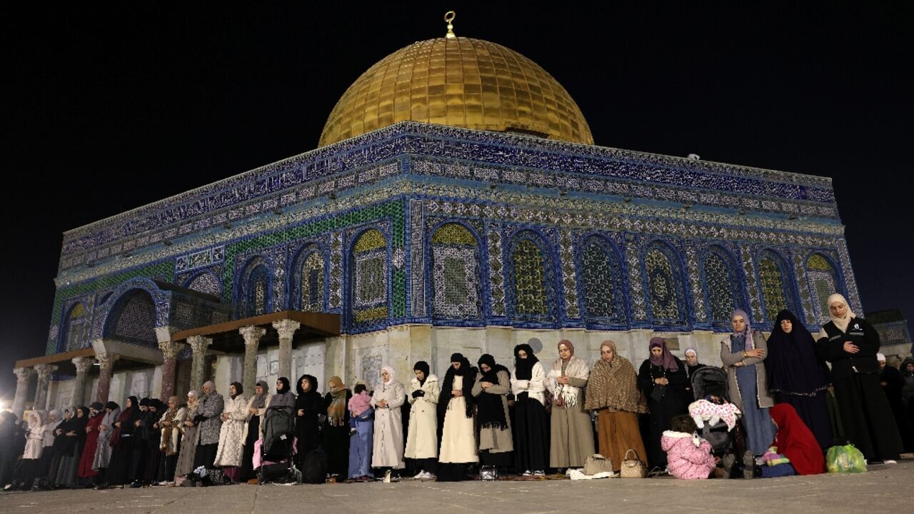 Palestinian Muslims hold eve-of-Ramadan prayers outside the Dome of the Rock in Israeli-annexed east Jerusalem.