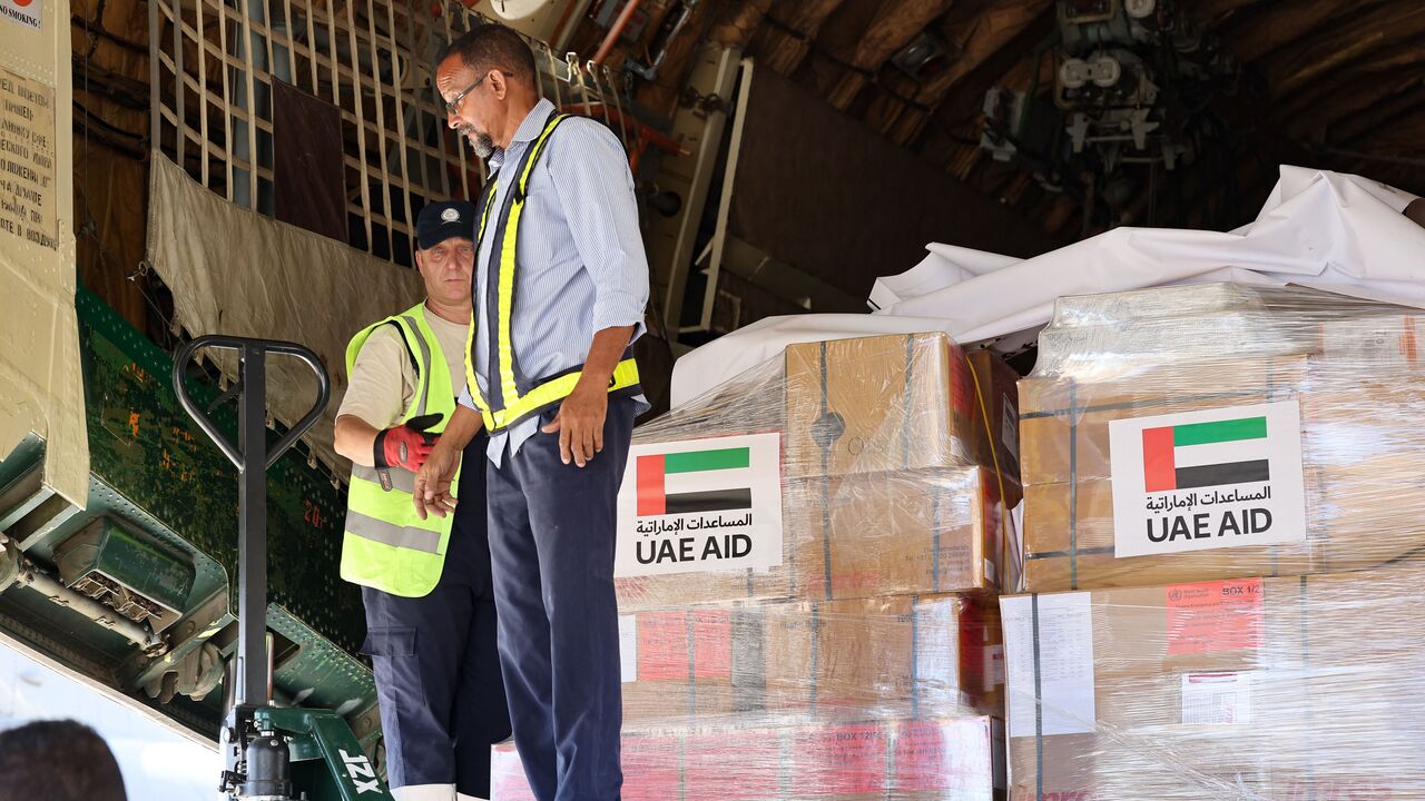 Workers unload aid from an aircraft upon it's arrival from the United Arab Emirates at the Port Sudan airport, on May 5, 2023. - Air strikes and gunfire rocked the Sudanese capital on May 5 as fighting showed no signs of abating, despite the threat of renewed US sanctions and warnings of a "protracted" conflict. (Photo by Giuseppe CACACE / AFP) (Photo by GIUSEPPE CACACE/AFP via Getty Images)