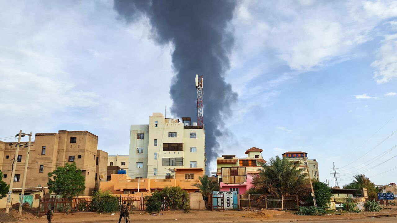 TOPSHOT - Black smoke billows behind buildings amid ongoing fighting in Khartoum on June 9, 2023. Sudan's warring generals have agreed to a 24-hour ceasefire from June 10, US and Saudi mediators said, acknowledging that previous attempts to pause a conflict now nearing its third month had proved abortive. (Photo by AFP) (Photo by -/AFP via Getty Images)