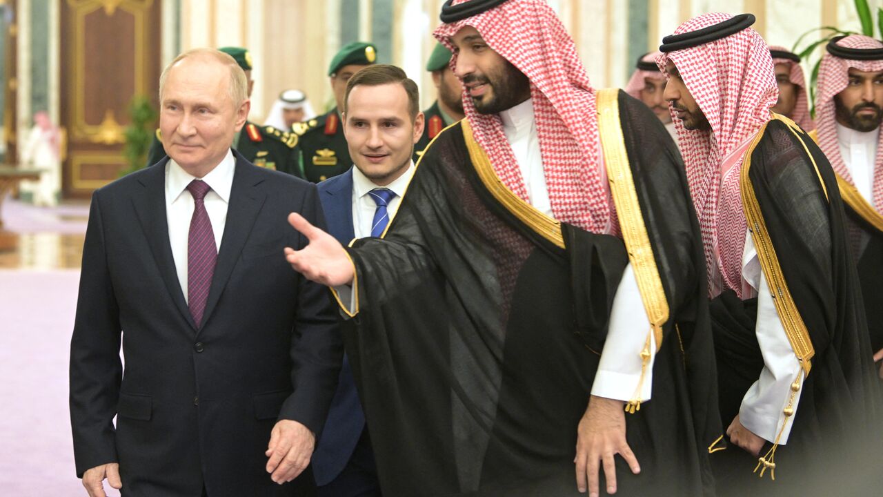 This pool photograph distributed by Russian state agency Sputnik shows Russia's President Vladimir Putin and Saudi Crown Prince Mohammed bin Salman attending a welcoming ceremony ahead of their talks in Riyadh on December 6, 2023. (Photo by Alexey NIKOLSKY / POOL / AFP) (Photo by ALEXEY NIKOLSKY/POOL/AFP via Getty Images)