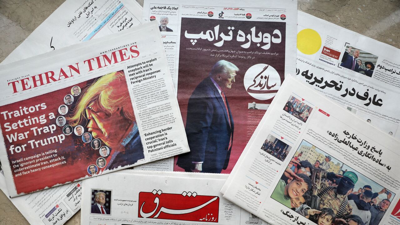 A picture shows copies of Iranian daily newspapers