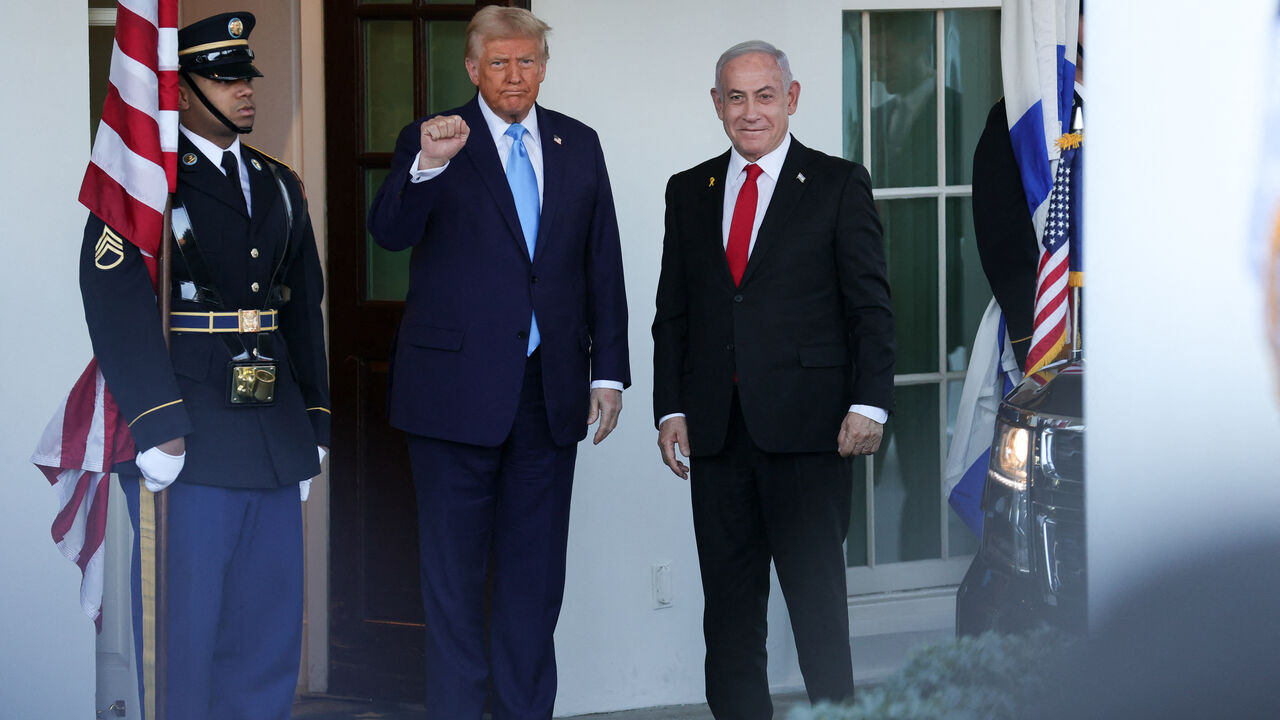 U.S. President Donald Trump greets Israeli Prime Minister Benjamin Netanyahu at the White House in Washington, D.C. on February 4, 2025. (Photo by Bryan Dozier / Middle East Images / Middle East Images via AFP) (Photo by BRYAN DOZIER/Middle East Images/AFP via Getty Images)
