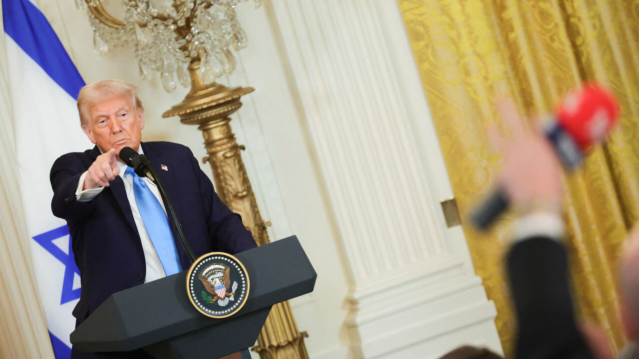 U.S. President Donald Trump takes questions from reporters during a press conference with Israeli Prime Minister Benjamin Netanyahu in the East Room of the White House in Washington, D.C. on February 4, 2025. (Photo by Bryan Dozier / Middle East Images / Middle East Images via AFP) (Photo by BRYAN DOZIER/Middle East Images/AFP via Getty Images)