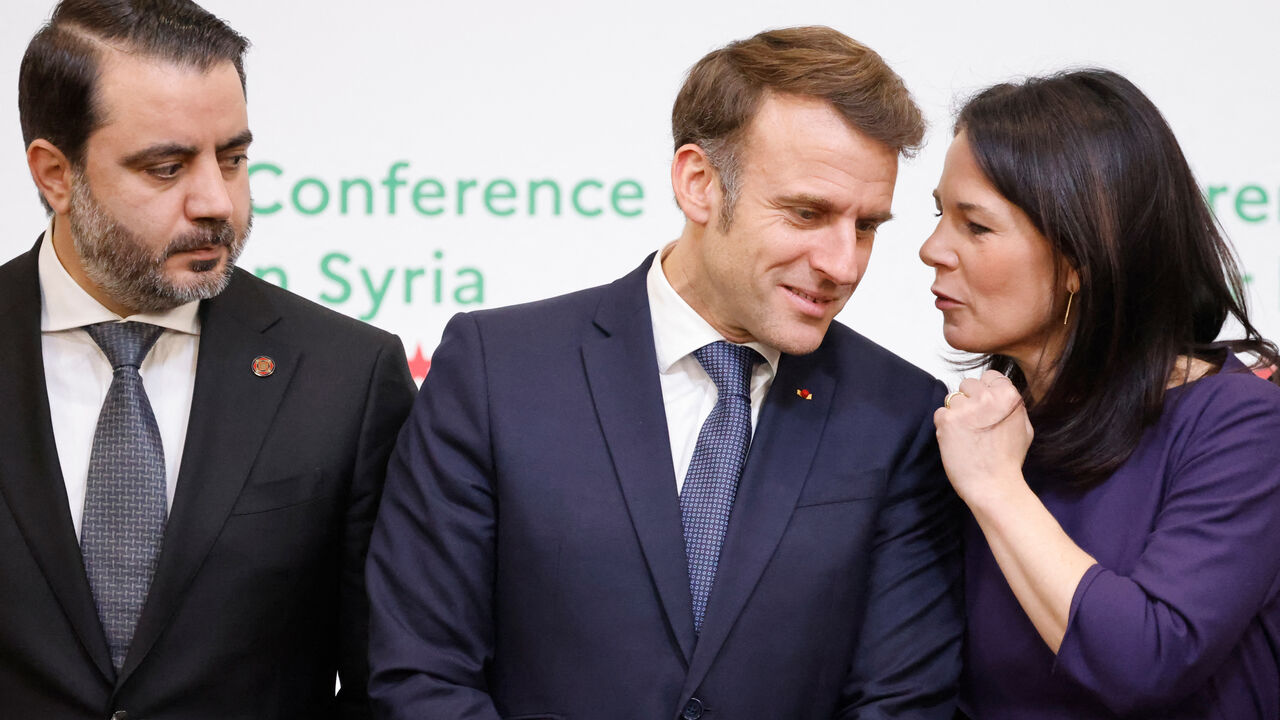 France's President Emmanuel Macron (C), Germany's Foreign Minister Annalena Baerbock (R) and Syria's Minister of Foreign Affairs Asaad Hassan al-Shaibani pose for a group photograph during the International Conference on Syria at the Ministerial Conference Center, in Paris on February 13, 2025. (Photo by Ludovic MARIN / POOL / AFP) (Photo by LUDOVIC MARIN/POOL/AFP via Getty Images)