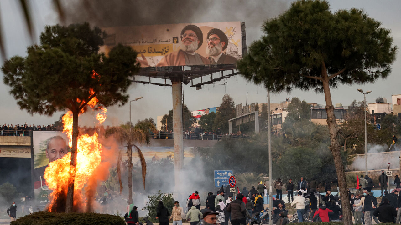 Teargas fumes erupt during clashes between supporters of the Lebanese Shiite Islamist movement Hezbollah and the Lebanese Army amidst a Hezbollah-organised rally to block the road to Beirut International Airport over a decision to bar two Iranian flights from landing there, in Beirut on February 15, 2025. An AFP correspondent said tear gas was fired to disperse crowds on February 15 after again blocking amidst calls by the Iran-backed group for a sit-in. (Photo by IBRAHIM AMRO / AFP) (Photo by IBRAHIM AMRO/