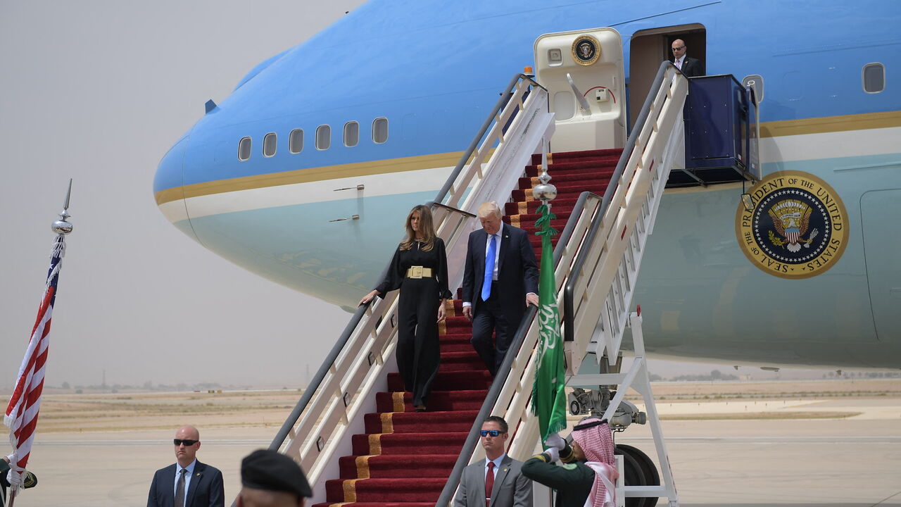 US President Donald Trump and First Lady Melania Trump step off Air Force One upon arrival at King Khalid International Airport in Riyadh on May 20, 2017. (Photo by MANDEL NGAN / AFP) (Photo by MANDEL NGAN/AFP via Getty Images)