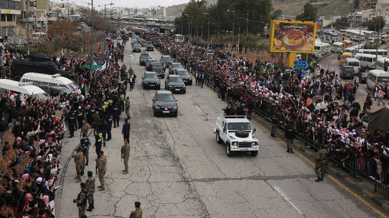 The crowds gathered despite cold and rain, many with placards expressing support for the position of King Abdullah II on Gaza