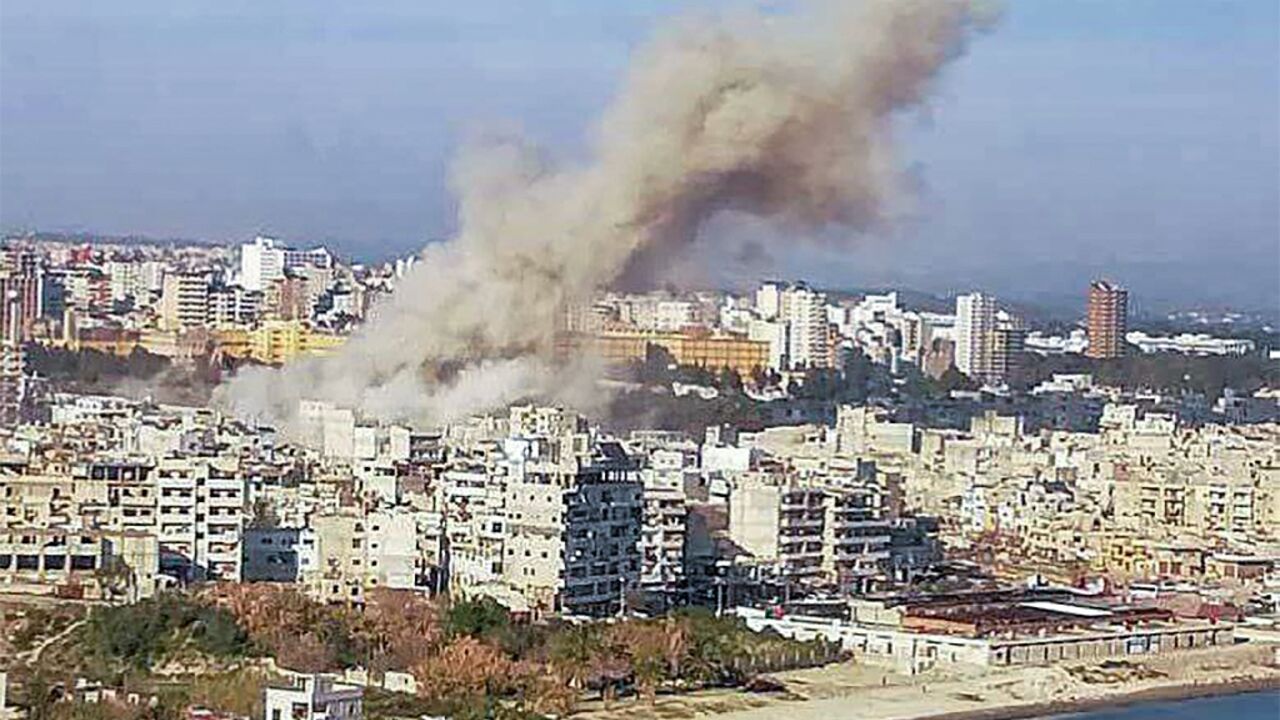 This picture released by Syrian state media shows smoke billowing over the coastal city of Latakia after a deadly explosion that a war monitor said was caused by unexploded ordnance. This picture released by Syrian state media shows smoke billowing over the coastal city of Latakia after a deadly explosion that a war monitor said was caused by unexploded ordnance.