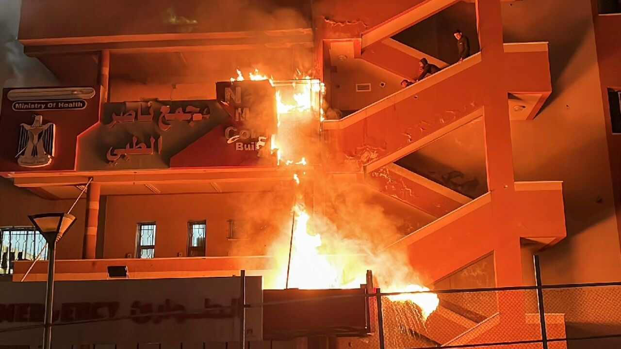 Fire burns at the emergency department of Nasser Hospital in Khan Yunis, southern Gaza, after an Israeli air strike Fire burns at the emergency department of Nasser Hospital in Khan Yunis, southern Gaza, after an Israeli air strike
