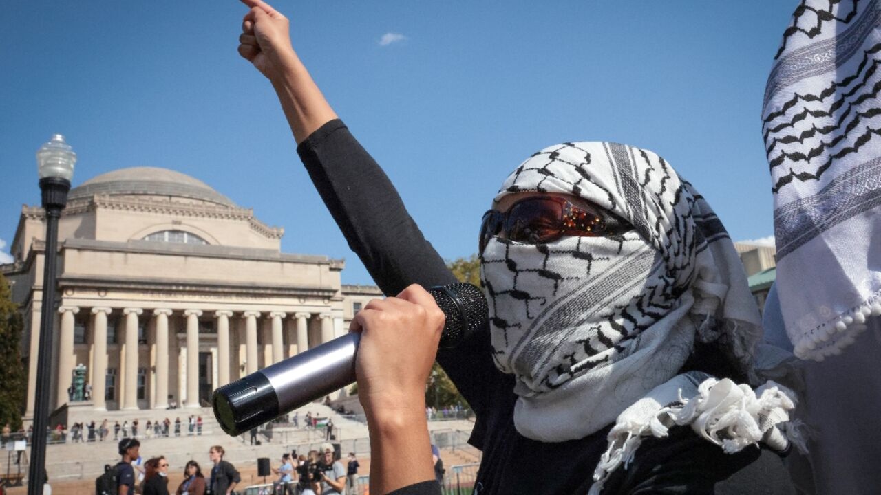 Pro-Palestinian demonstrators march through the Columbia University campus to mark one year of the war between Hamas and Israel in New York City on October 7, 2024 Pro-Palestinian demonstrators march through the Columbia University campus to mark one year of the war between Hamas and Israel in New York City on October 7, 2024