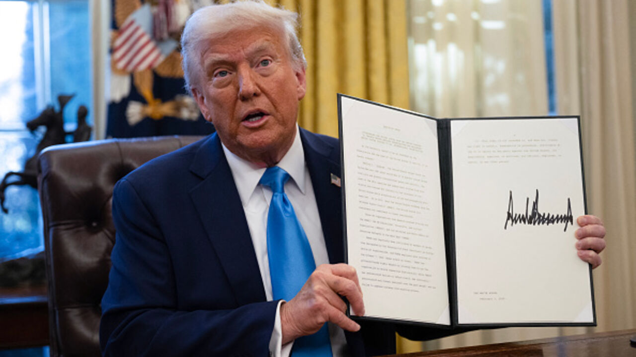 US President Donald Trump shows an executive order withdrawing his country from a number of United Nations bodies in the Oval Office of the White House on February 4, 2025 in Washington, DC. Trump on Tuesday signed an executive order withdrawing his country from a number of United Nations bodies, including its Human Rights Council (UNHRC), and setting up a broader review of US funding for the multilateral organization. The executive order said it withdrew Washington from UNHRC and the main UN relief agency