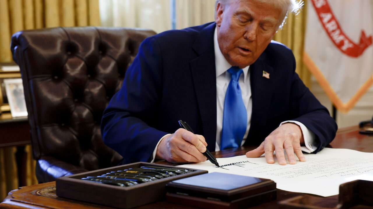 US President Donald Trump signs an executive order "reimposing maximum pressure on Iran" in the Oval Office of the White House on Feb. 4, 2025 in Washington, DC.