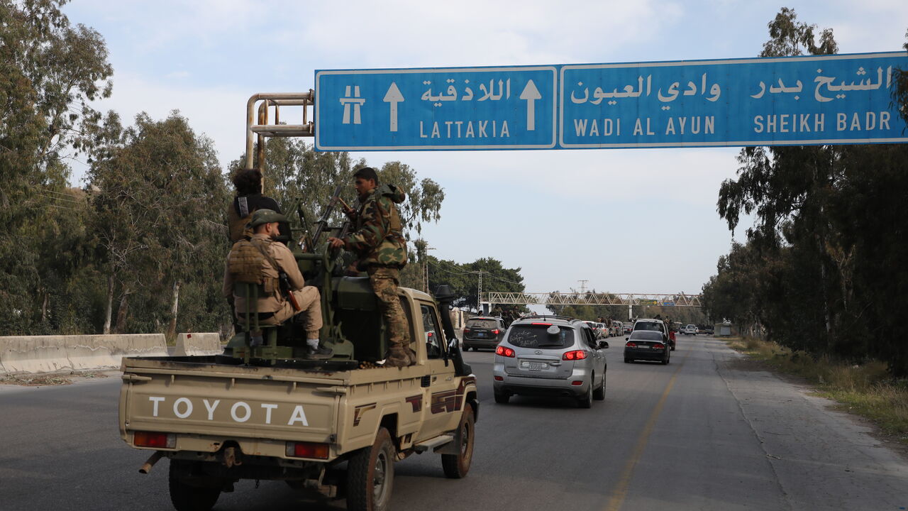 SYRIA - MARCH 7: Fighters with the new Syrian government drive between Tartus and Latakia on March 7, 2025 on the road between Tartus and Latakia, Syria. Dozens of people have been killed in clashes between loyalists of the deposed Assad regime and forces of the country's new rulers. It is the heaviest such fighting since Syrian rebels toppled the Assad regime last December. (Photo by Ali Haj Suleiman/Getty Images)