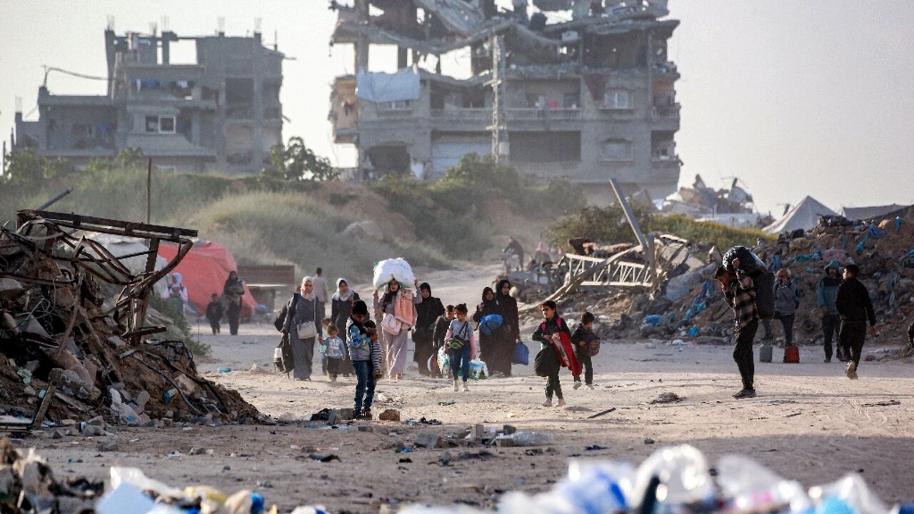 In Beit Hanoun, residents began to flee with bags and blankets piled on their heads In Beit Hanoun, residents began to flee with bags and blankets piled on their heads