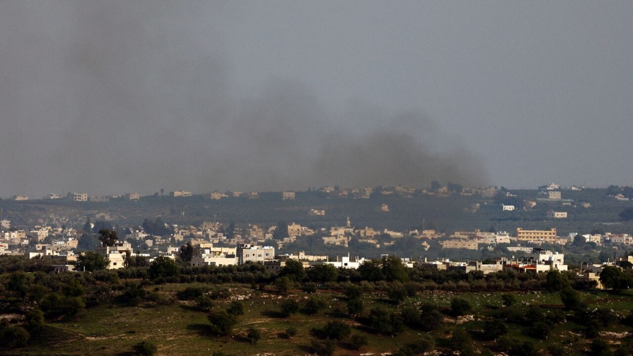 A picture taken from the Israel-annexed Golan Heights shows smoke billowing above the Syrian village of Kuwayya A picture taken from the Israel-annexed Golan Heights shows smoke billowing above the Syrian village of Kuwayya