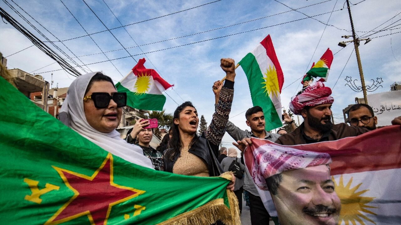 Demonstrators in mainly Kurdish northeastern Syria wave Kurdish flags as they protest against the temporary constitution adopted by the interim government in Damascus. Demonstrators in mainly Kurdish northeastern Syria wave Kurdish flags as they protest against the temporary constitution adopted by the interim government in Damascus.