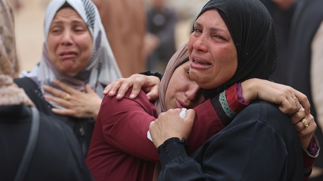 Palestinians mourn during a funeral of relatives killed in an Israeli strike on a school-turned-shelter at the Al-Shifa hospital in Gaza City Palestinians mourn during a funeral of relatives killed in an Israeli strike on a school-turned-shelter at the Al-Shifa hospital in Gaza City