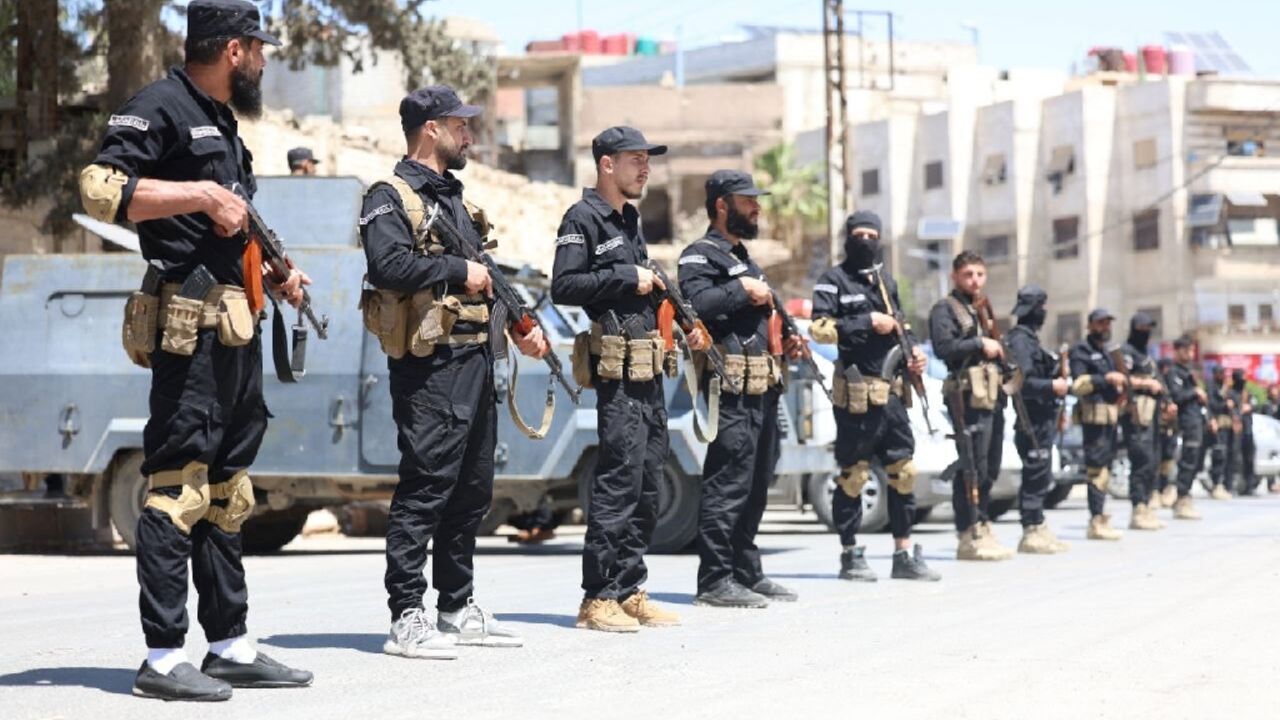 This handout picture released by the Syrian Interior Ministry Facebook page shows Syria's security forces standing guard in a street in the mostly Druze and Christian Jaramana suburb of Damascus This handout picture released by the Syrian Interior Ministry Facebook page shows Syria's security forces standing guard in a street in the mostly Druze and Christian Jaramana suburb of Damascus