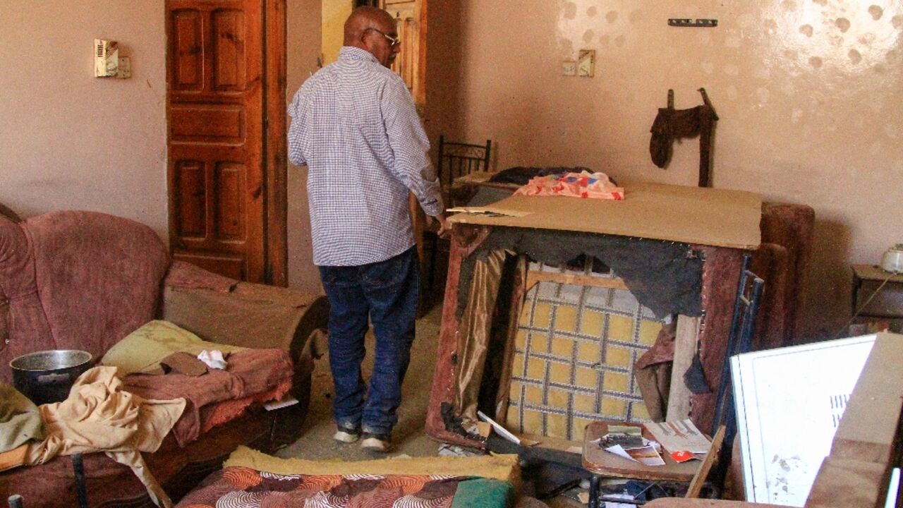 AFP journalist Abdelmoneim Abu Idris Ali in his ransacked home in Khartoum AFP journalist Abdelmoneim Abu Idris Ali in his ransacked home in Khartoum
